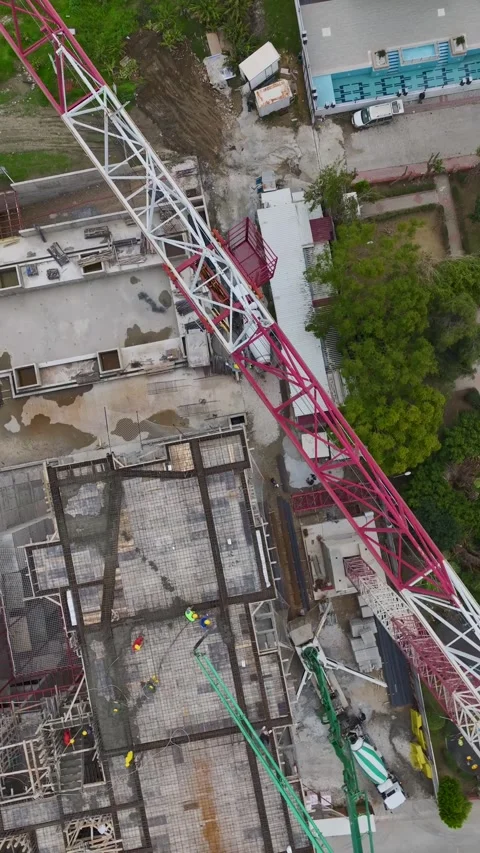 Vertical Video Top Down View of Construction Workers Positioned Across Structure Video stock 342109191
