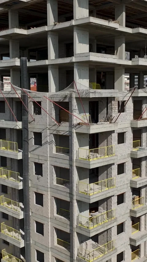 Vertical Video Top View of Building Skeleton with Wooden Framework and Workers Stock Footage 342442179