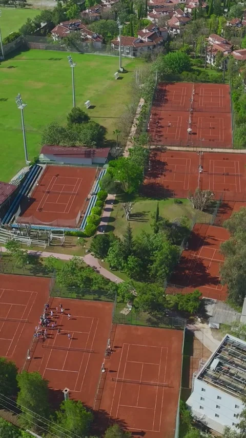 Vertical Video Top View Clay Court Texture with Players Creating Dynamic Stock Footage 341791715