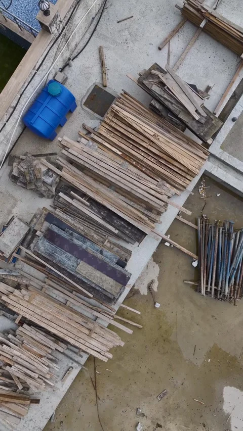 Vertical Video Top View Construction Materials Stacked on Concrete Surface Stock Footage 342134824