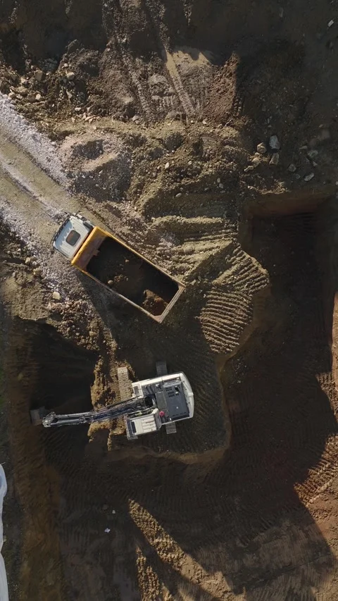 Vertical Video Top View Construction Excavator Operating in Dirt Pit 스톡 동영상 342448885