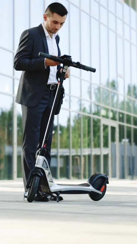 Vertical Video of Tourist taking e-scooter or bicycle. Phone application for Stock Footage 304176453