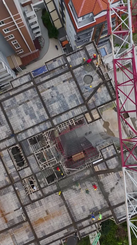Vertical Video Tower Crane Operating Above Coastal Construction Area Video stock 342105571