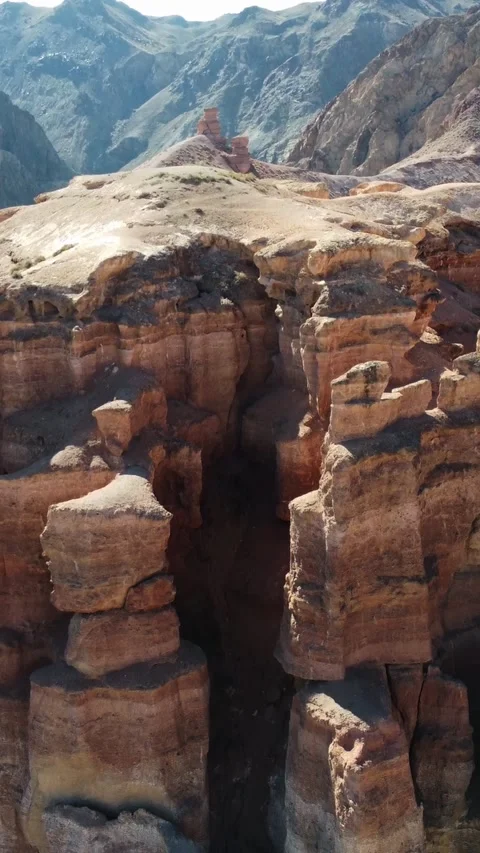 Vertical video Towering red sandstone pillars, Martian Charyn Canyon, Kazakhstan Stock Footage 336692031