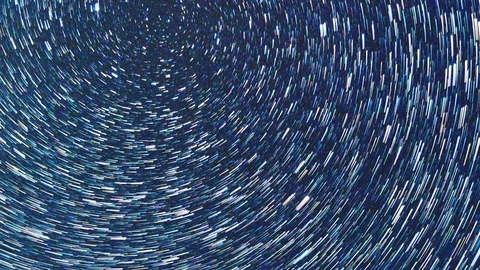 Vertical video. Tracks from stars in the form of spiral fading lines. Time Lapse Stock Footage