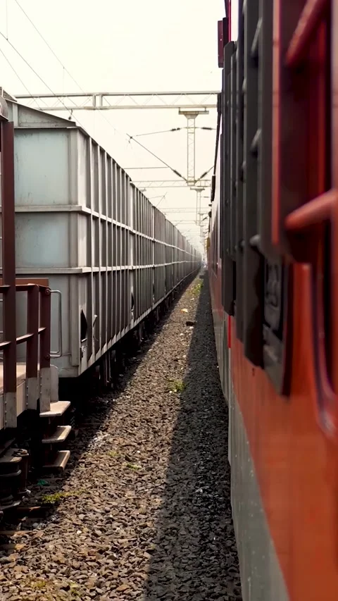 Vertical Video of Train Passing Rapidly on Tracks Through a Scenic Rural Journey Stock Footage 321664396