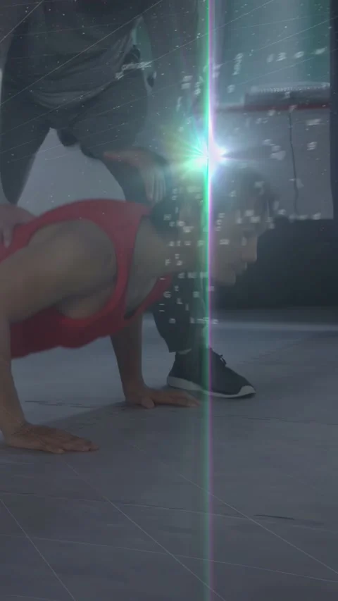 Vertical video: Trainee doing pushups in gym coach cueing feet alignment, HUD Stock Footage 332806768
