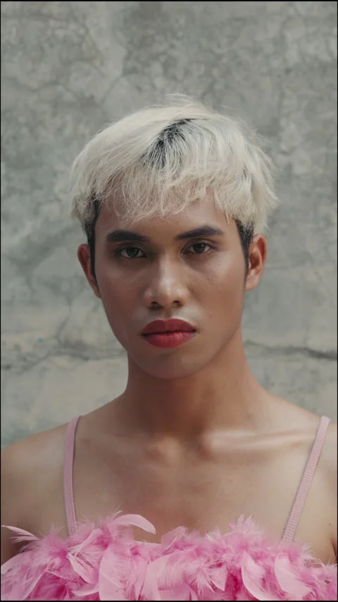 Vertical Video. Transgender Man Stands in the Middle of the Street Sad and Takes Stock Footage 276218653