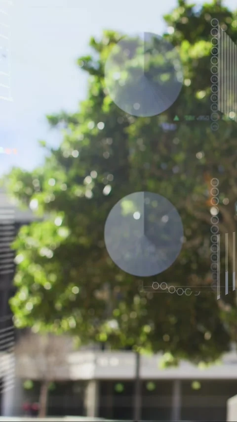 Vertical video: Tree canopy filling frame, data stream activating HUD overlays Stock Footage 333840061