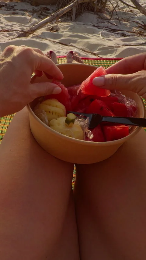 Vertical video. Tropical Beach Picnic, First Person View of Woman Holding Fresh Stock Footage 332295273
