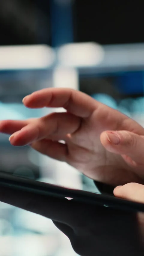 Vertical video Troubleshooting, tablet closeup and admin in data center Stock Footage 329321198