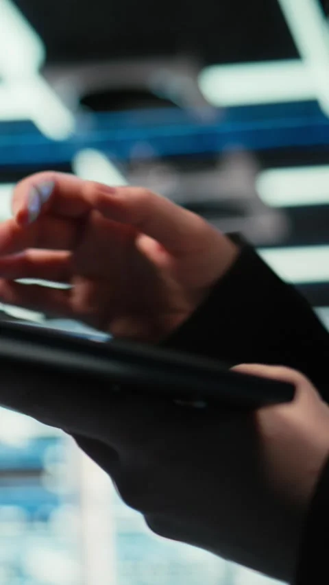 Vertical video Troubleshooting, tablet closeup and admin in data center Stock Footage 329321632