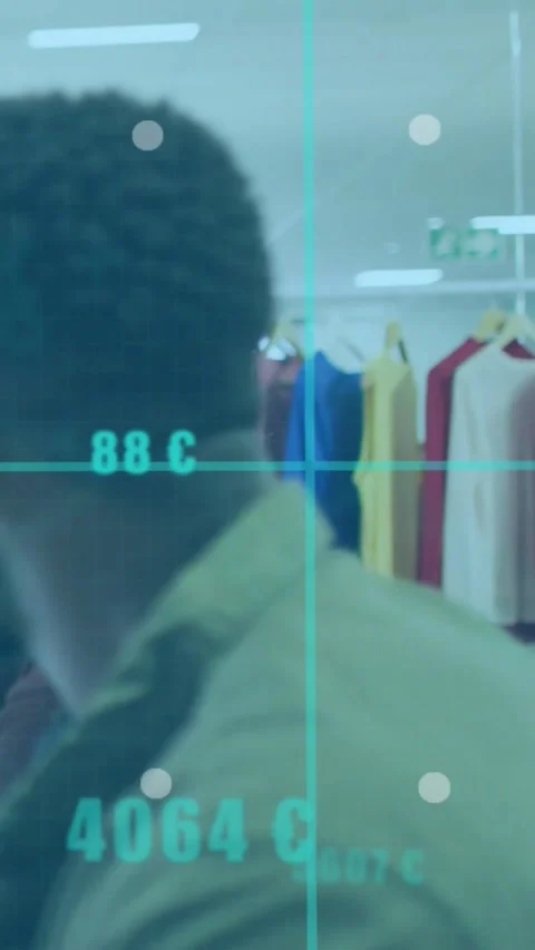 Vertical video: Turning man in olive shirt scanning rack in store as teal graphs Stock Footage 334395944