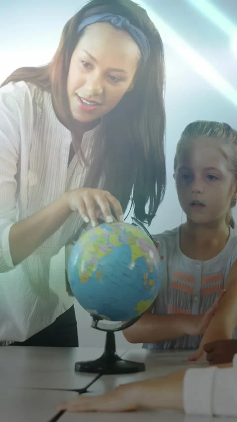 Vertical video: Tutor placing hand on globe, spinning and pointing, teaching Stock Footage 331333995