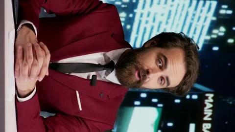 Vertical video TV host addressing breaking news Video stock 247471748