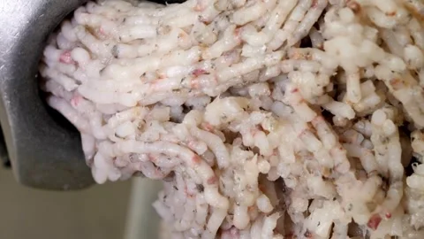 Vertical video. Twisting sea fish fillets in an electronic meat grinder. Stock Footage 248906452