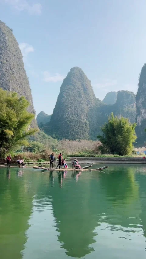 Vertical Video of Two Bamboo Rafts with Tourists in Guilin Karst Landscape Video stock 328439813