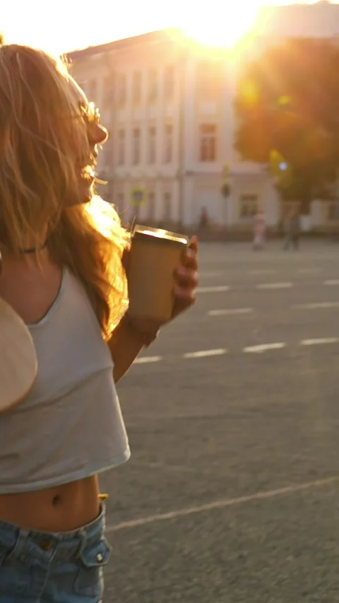 Vertical Video. Two beautiful stylish multicultural girls walking together and Stock Footage 299839374