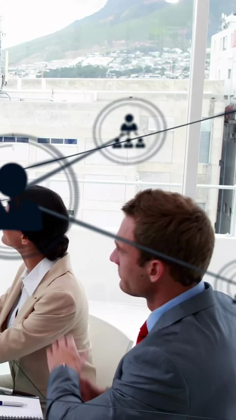 Vertical video: Two business pros clapping in meeting as left network icons Stock Footage 334317227