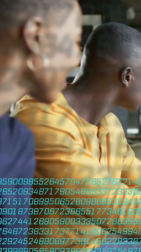 Vertical video: Two colleagues turning to cue while data overlay rising over Stock Footage 334128001
