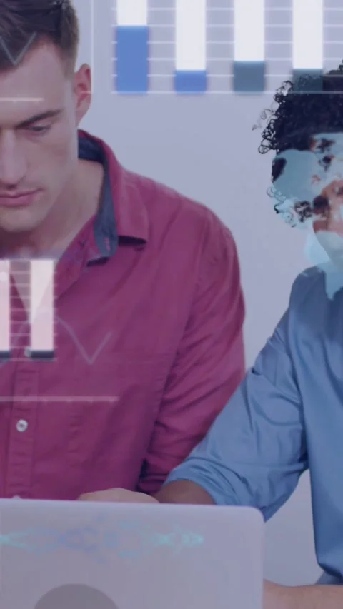 Vertical video: Two developers at laptop, code and chart overlays appearing, Stock Footage 334187259