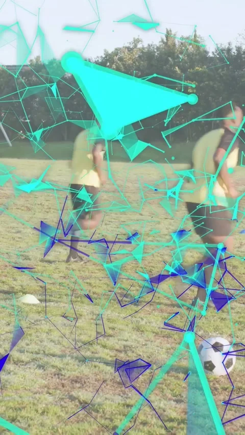 Vertical video: Two men chasing and kicking toward goal after ball rolling in Stock Footage 332669689