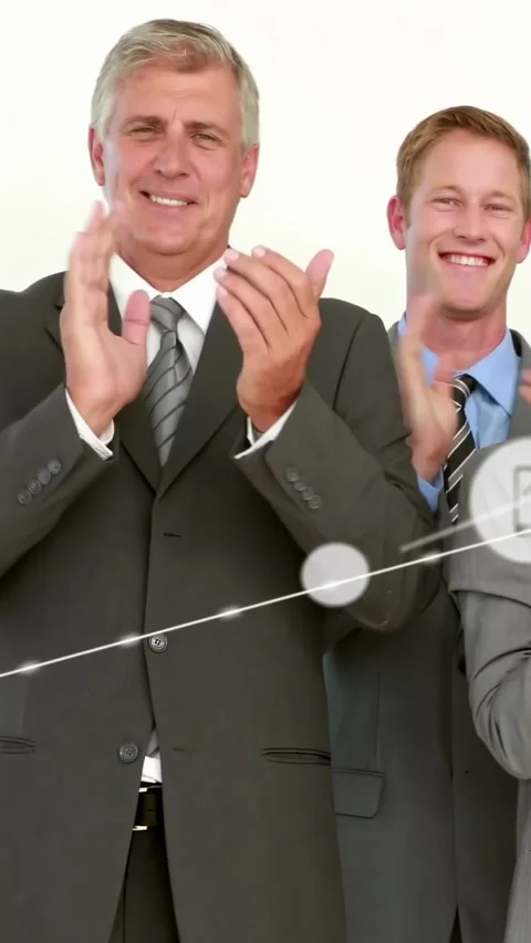 Vertical video: Two men clapping in corporate set after reveal, UI icons Stock Footage 334317268