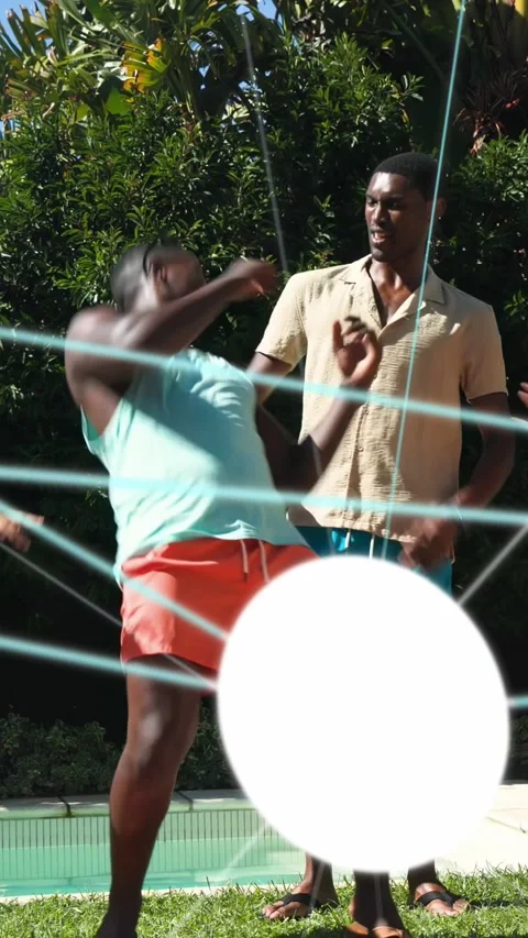 Vertical video: Two men dancing poolside to social music, one swinging other Stock Footage 333821704