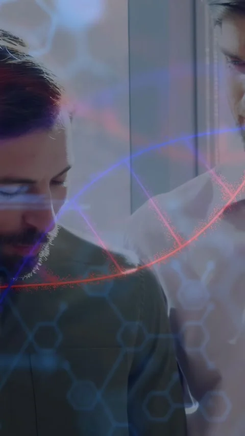 Vertical video: Two men leaning over tablet causing code and helix scrolling Stock Footage 331166854