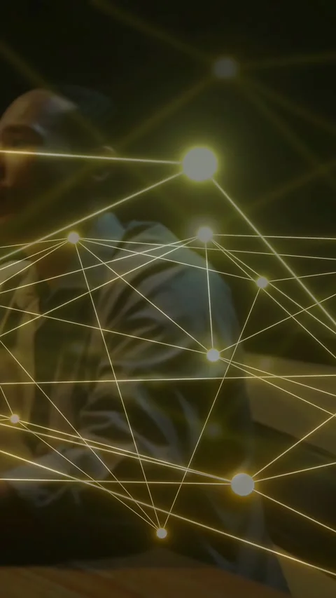 Vertical video: Two men at table, second joining, sparking golden node-line over Stock Footage 333862369