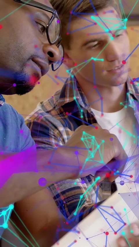 Vertical video: Two men at tablet, one holding while second tapping, showing for Stock Footage 333953489
