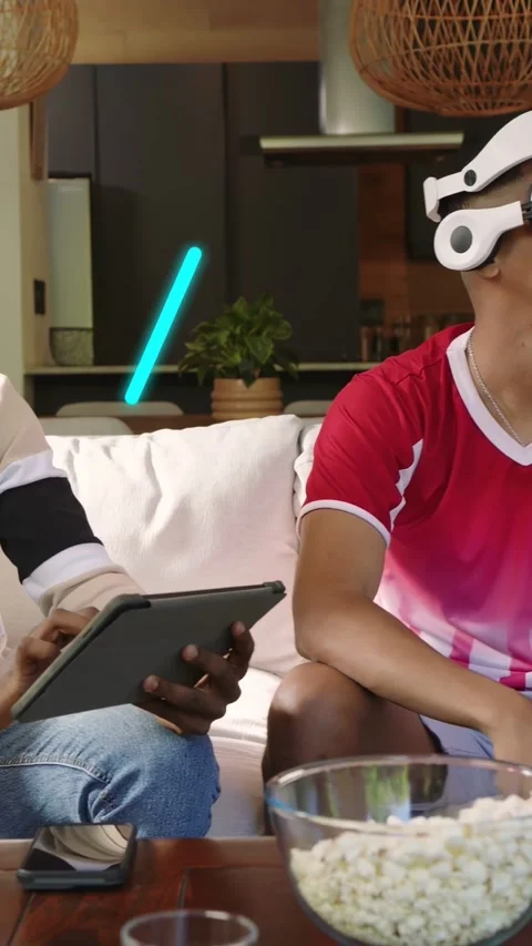 Vertical video: Two men tapping tablet and adjusting VR headset, testing game Stock Footage 333109826