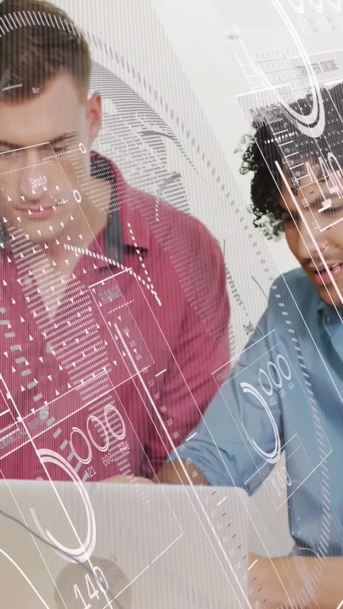 Vertical video: Two men in tech studying laptop right man starting HUD charts Stock Footage 334598430