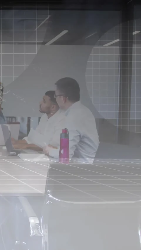 Vertical video: Two men typing, following business talk, grid casting over Stock Footage 332317540