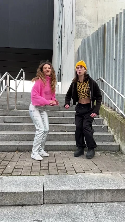 Vertical video of two people jumping together in slow motion. Stock Footage 259688094