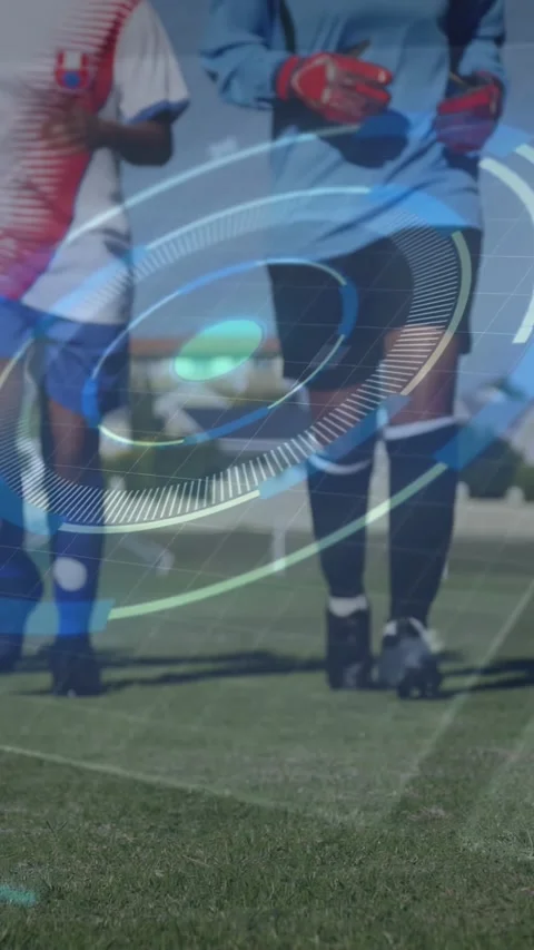 Vertical video: Two players stepping toward lens on pitch, HUD rings rotating Stock Footage 330794919