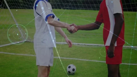 Vertical video: Two soccer players stepping, shaking hands at goal, overlays Stock Footage 331269671