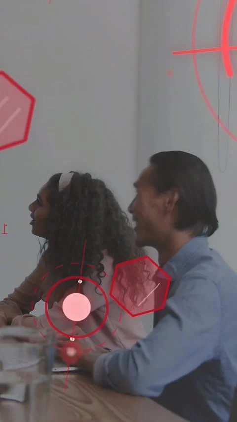 Vertical video: Two staff watching business slides on screen, clapping with red Stock Footage 333541971