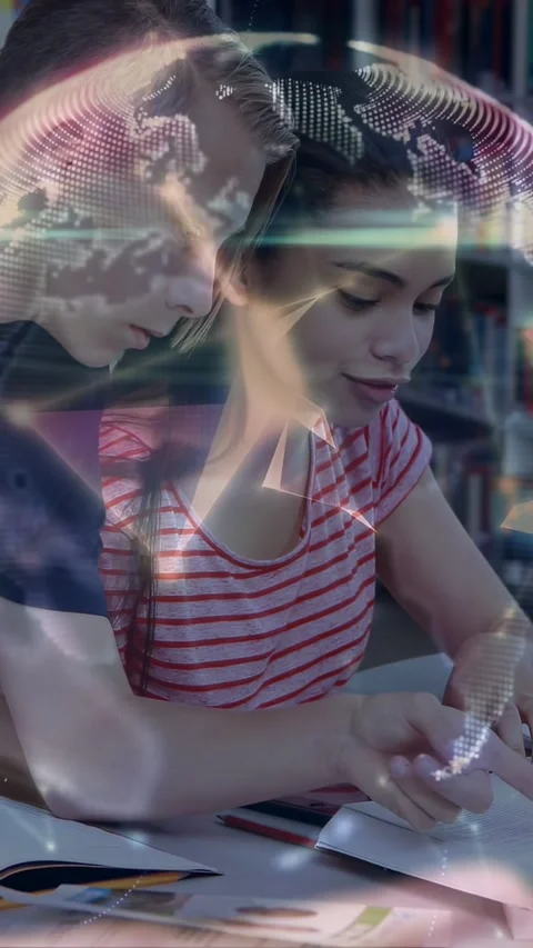 Vertical video: Two teens studying in library, boy pointing and causing globe Stock Footage 333896272