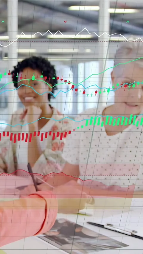 Vertical video: Two women checking cards after peer passing pics, data charts Video stock 337543410
