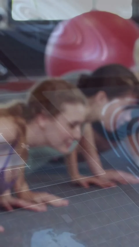 Vertical video: Two women doing synced pushups on mats for fitness on cue, faint Stock Footage 340133580