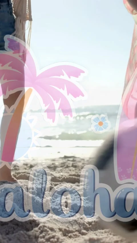Vertical video: Two women joining, walking to water, aloha overlay travel, denim Video stock 333596346
