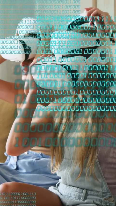 Vertical video: Two women testing white VR, causing teal code overlay, fixing Stock Footage 333861921