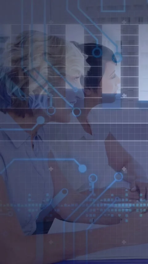 Vertical video: Two women typing on keys and activating HUD overlay while Stock Footage 333079681