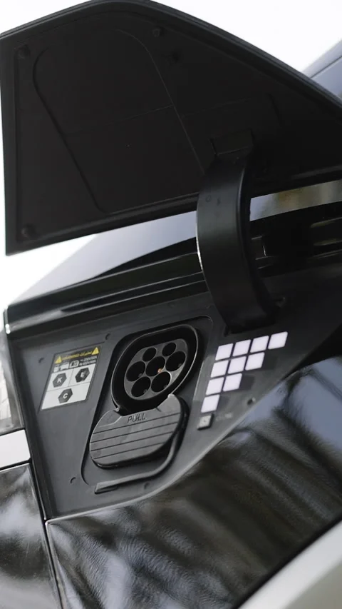 Vertical Video of Type 2 CCS Combo plug port on electric vehicle. Fast charging Stock Footage 306744649