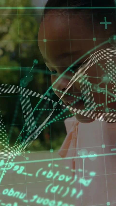 Vertical video: Typing child wearing pink collar bow reacting to DNA overlay on Stock Footage 334319285