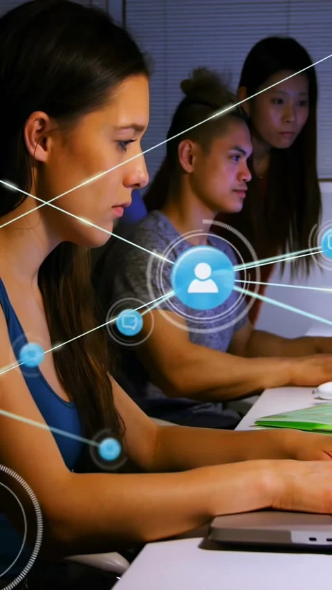 Vertical video: Typing left woman in blue working at laptop, UI forming over Stock Footage 334602719