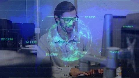 Vertical video: Typing man with glasses light shirt at office desk, reacting to Stock Footage 333859195