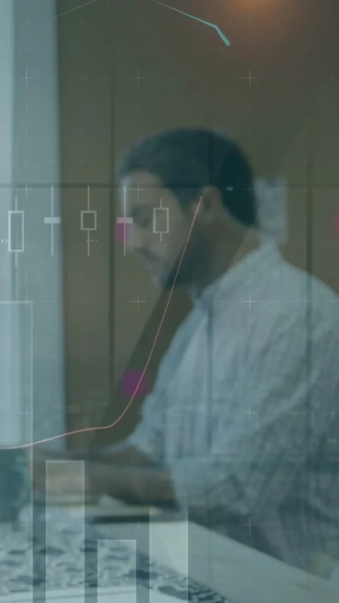 Vertical video: Typing man wearing shirt at window desk, studying laptop chart Stock Footage 333006267