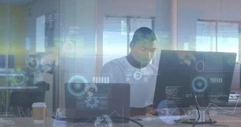 Vertical video: Typing man in white tee analyzing data at office desk with Stock Footage 331380367